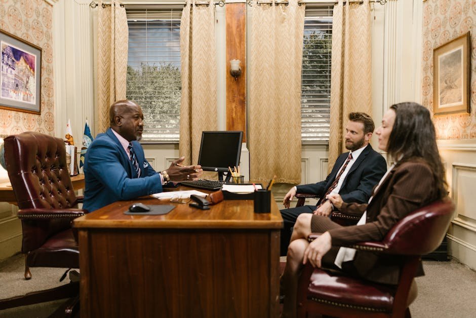Therapist meeting with attorney client in confidential office setting