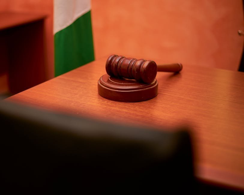 Civil courtroom with empty bench and AOT case file representing assisted outpatient treatment hearing