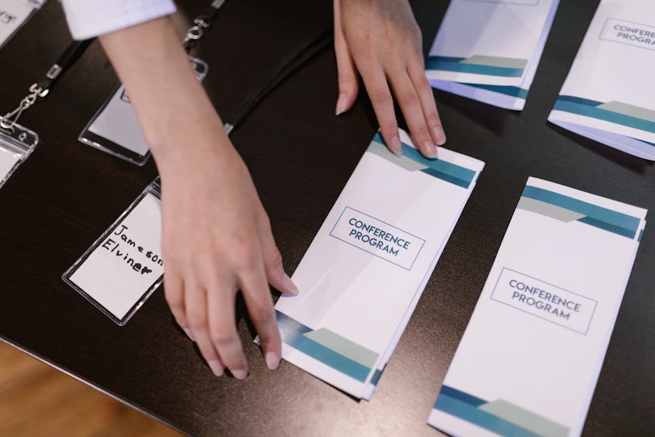 Hospital ethics committee meeting around conference table with documents