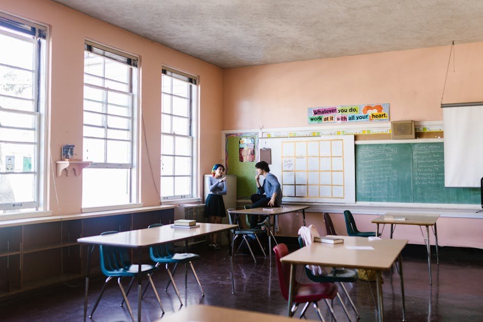 Recovery high school classroom with small group of students working with teacher