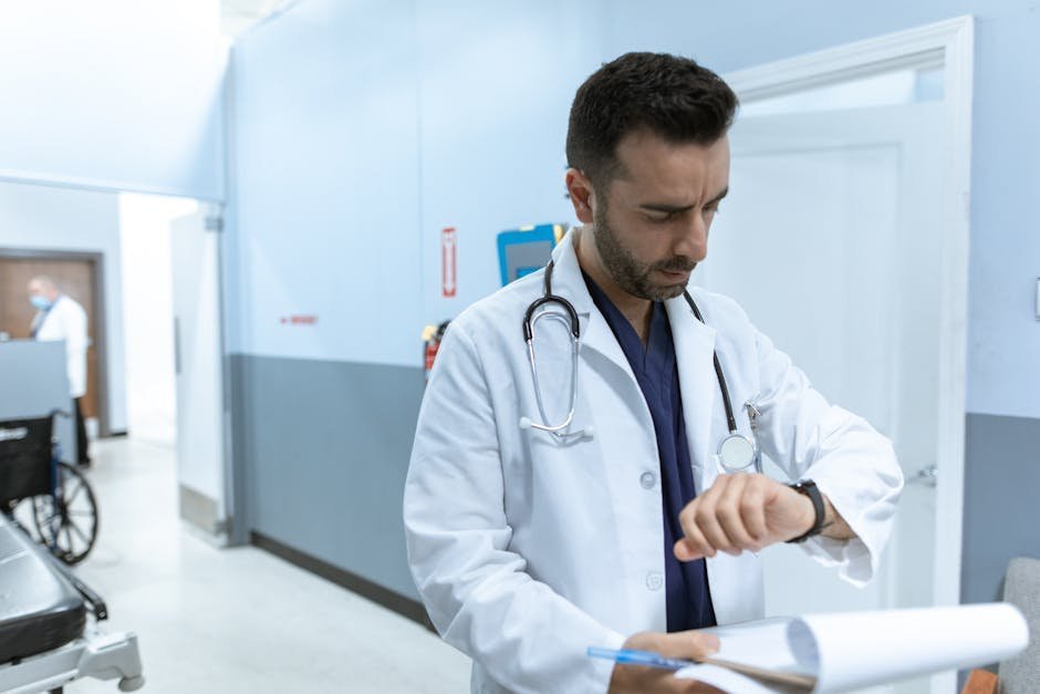 Physician in white coat sitting in counseling office during health professional treatment program
