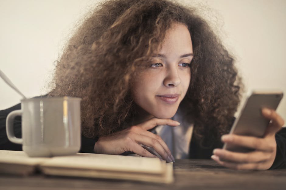 Person looking thoughtfully at phone, considering whether to answer a call from a struggling friend