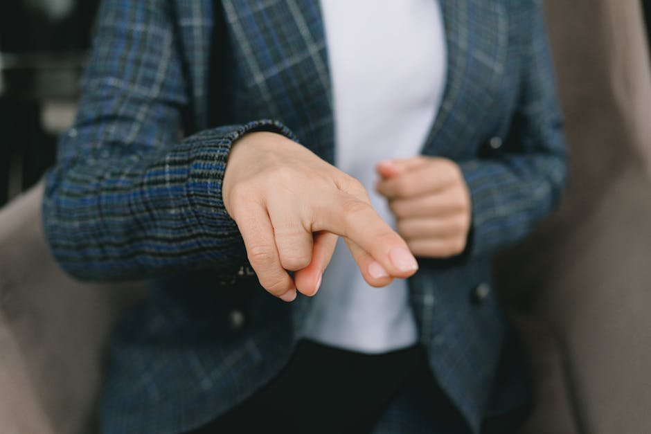 Clinician demonstrating AIMS scale finger tapping examination
