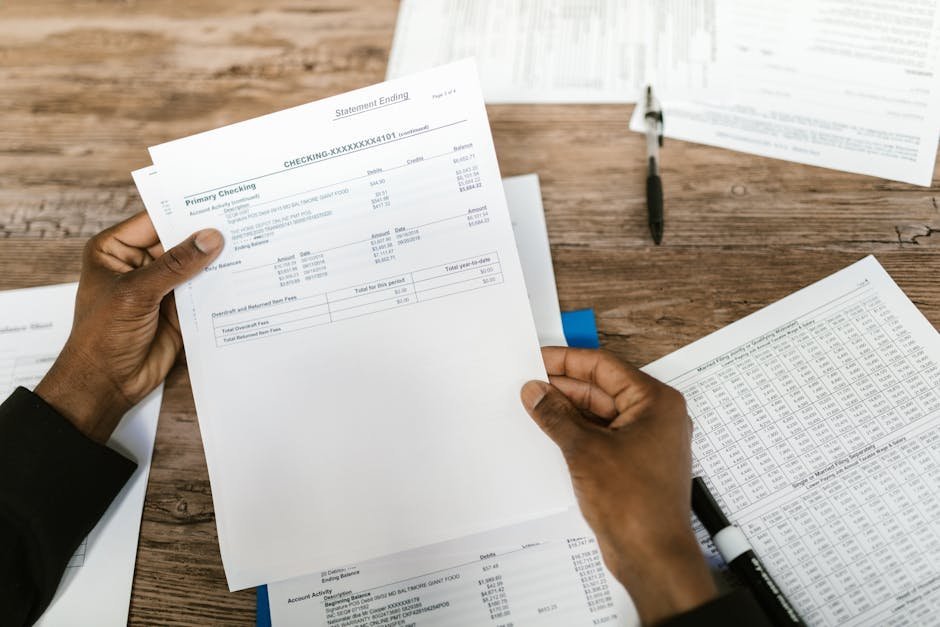 Calculator and insurance paperwork showing premium calculations