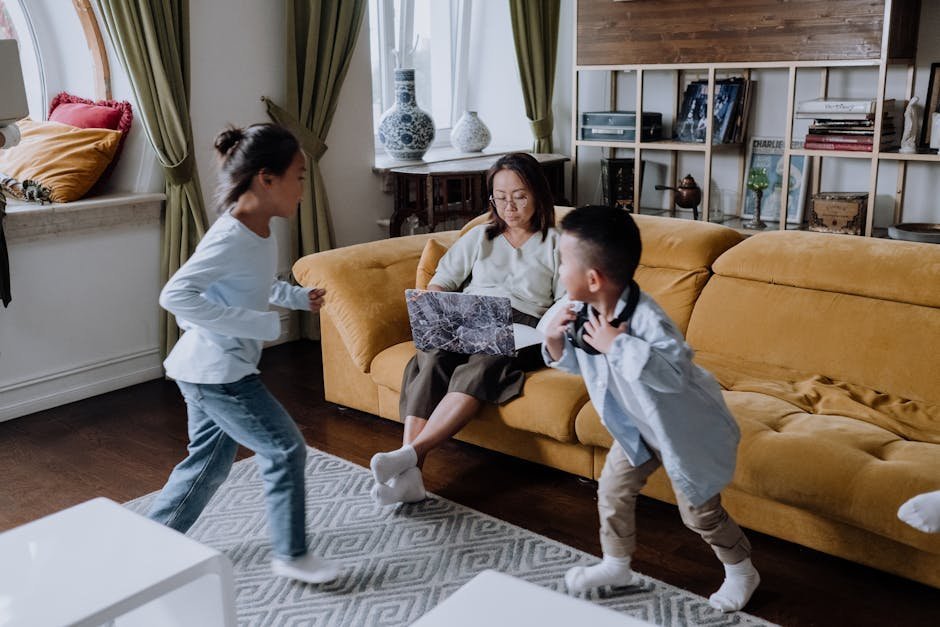 Family at home with mother and children playing together
