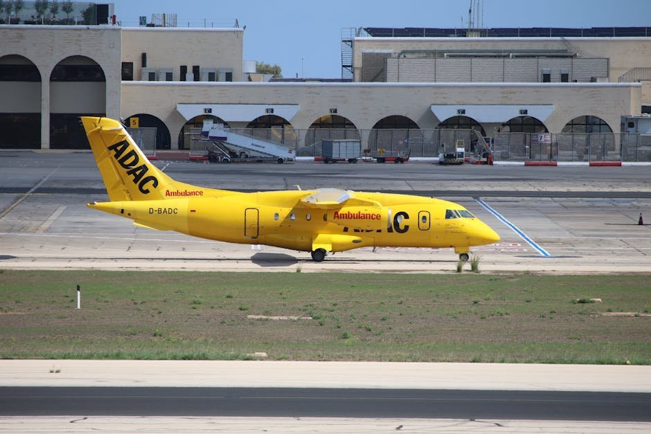 Air ambulance airplane on tarmac with medical team