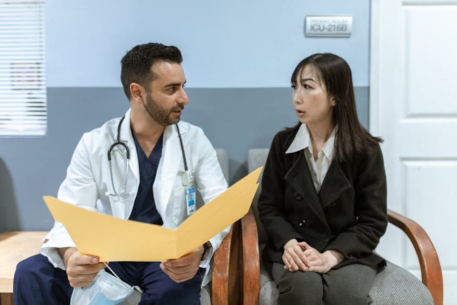 Doctor and patient having unhurried conversation in modern clinic