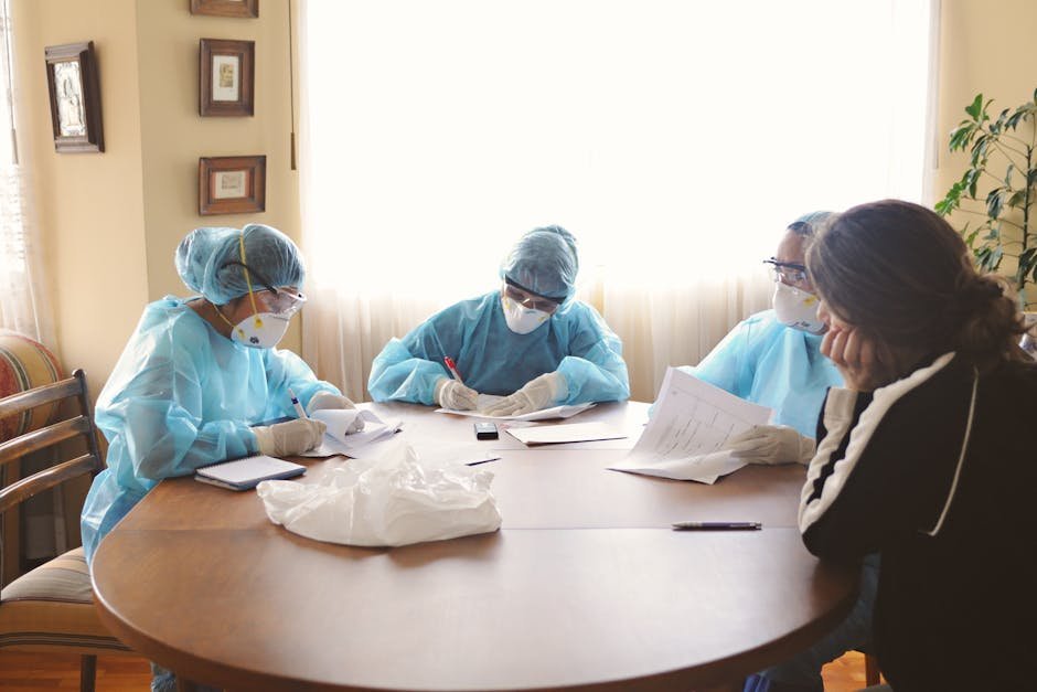 Mobile crisis clinician meeting with family and teenager in living room setting