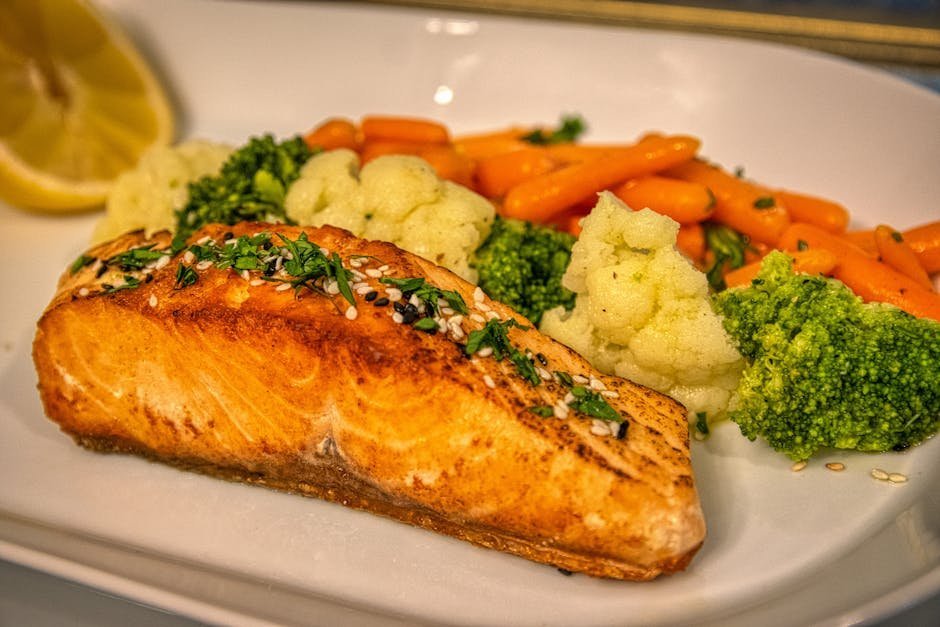 Salmon fillet with vegetables on a plate as a natural source of omega 3