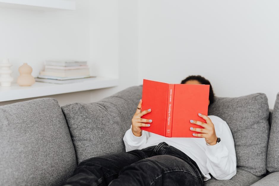 Person reading recovery literature in quiet space