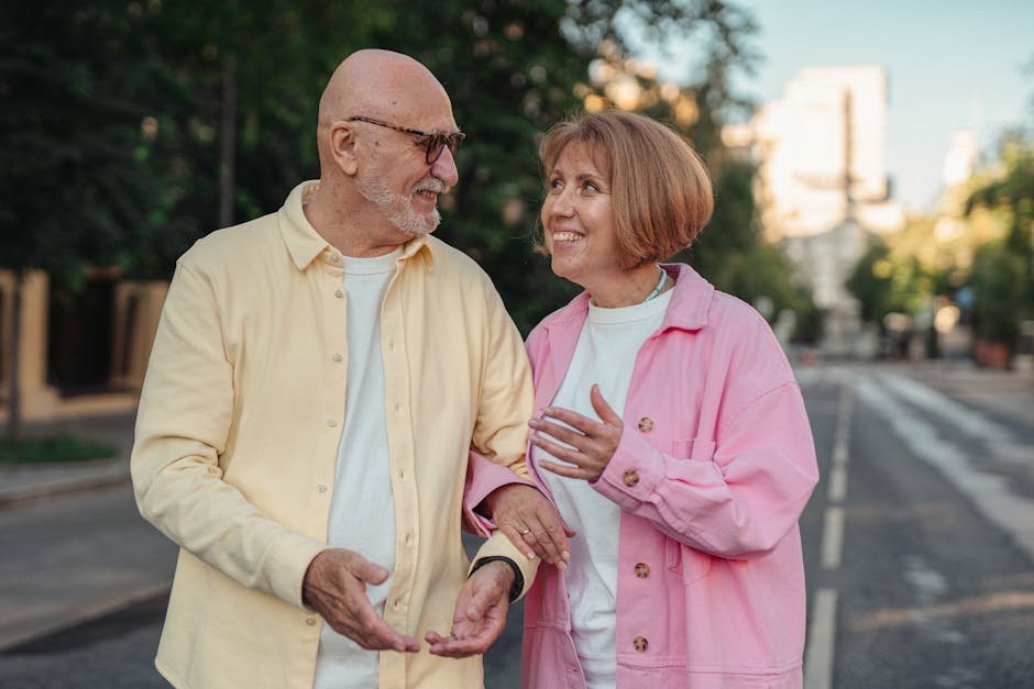 Retired couple walking together on community trail