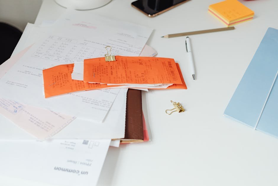 Certified mail receipts and tracking documents organized in a folder