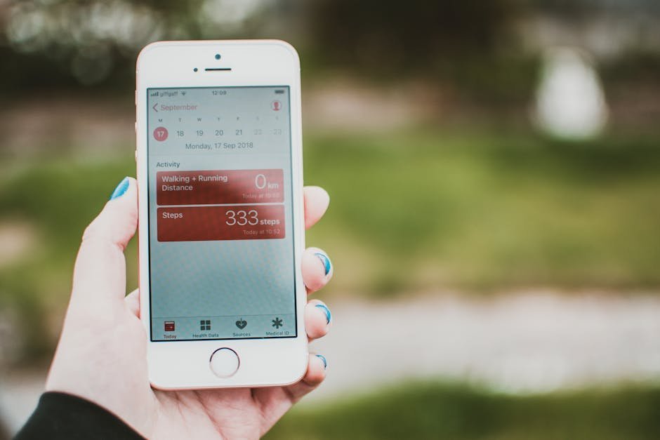 Smartphone displaying alcohol tracking app with weekly progress chart, calendar showing alcohol-free days