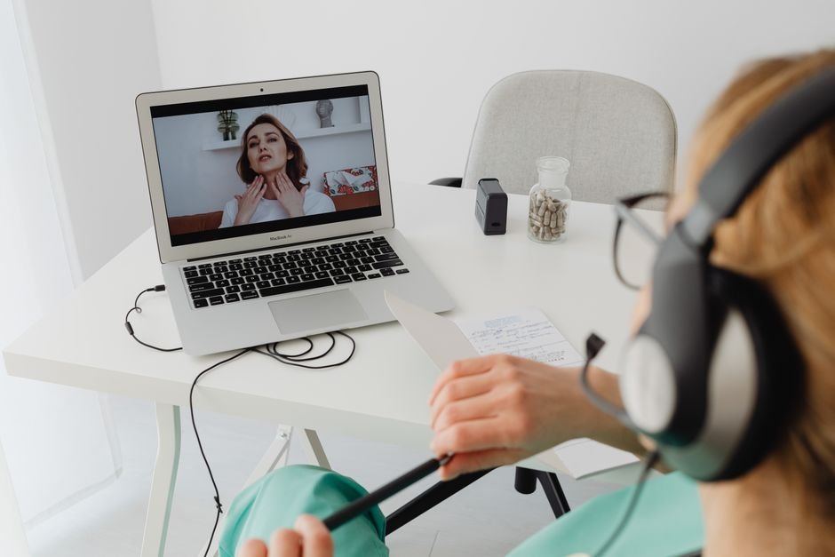 A healthcare professional on a video call, the way an online psychiatrist meets with a patient from home